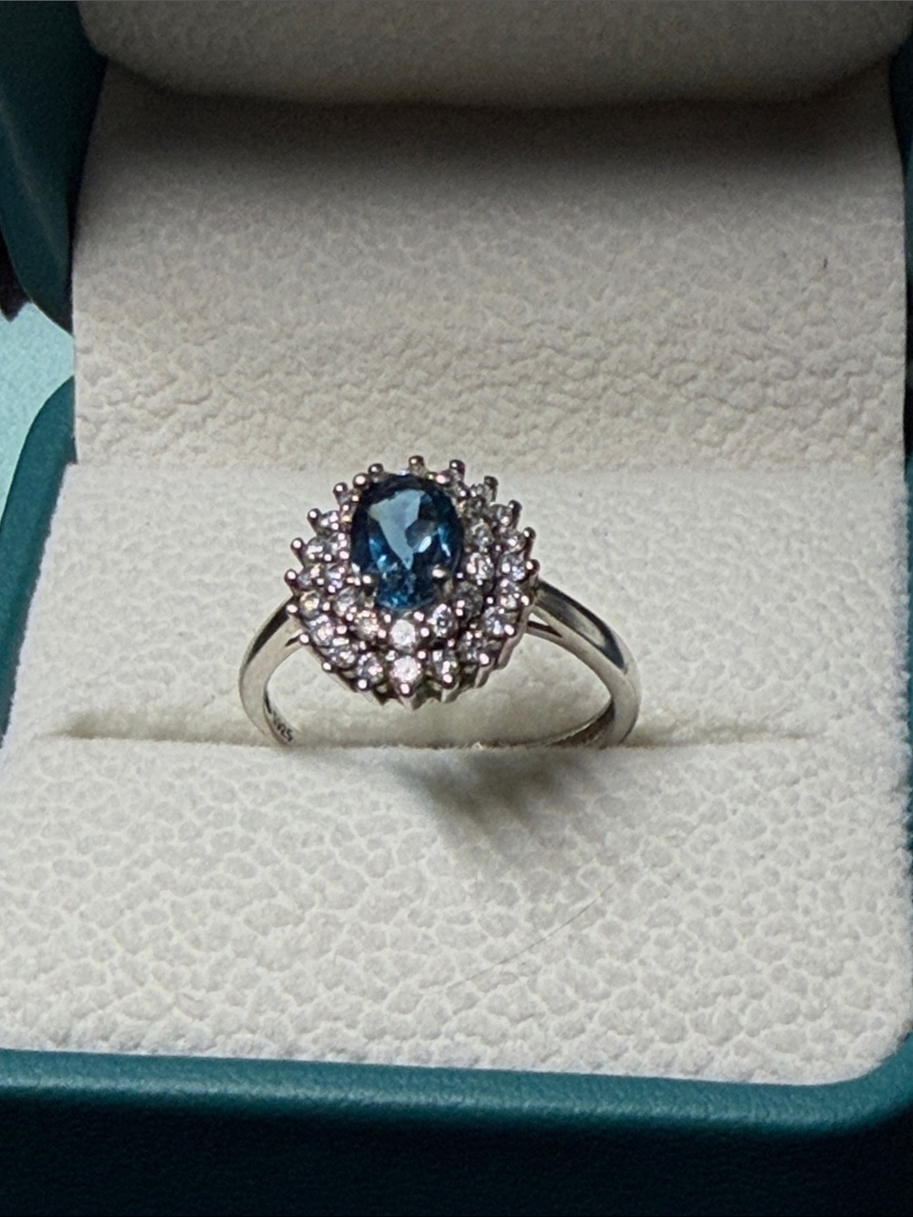Blue Oval Halo Cocktail Ring with Clear Accent Stones